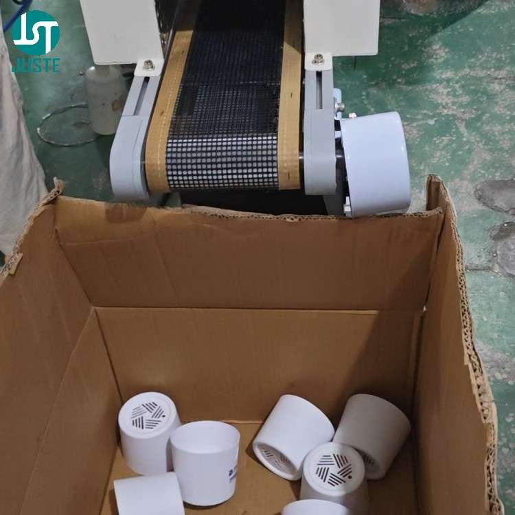 IR tunnel oven curing freshly printed cylindrical products after screen printing