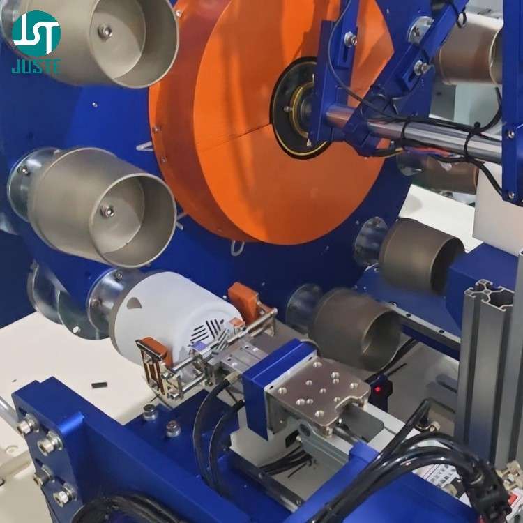 Mechanical arm unloading printed cylindrical parts onto conveyor after screen printing